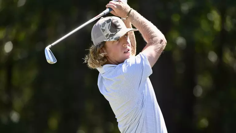 Camden Braidech holds a high finish on an iron approach to the green.