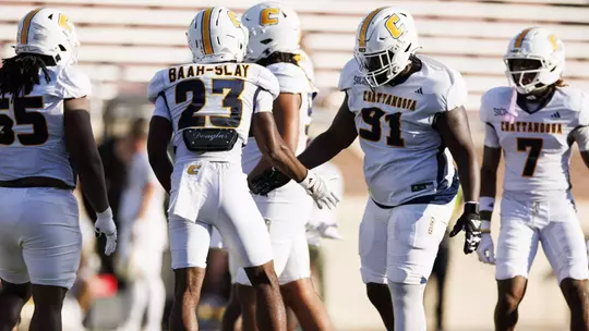 The Mocs defense celebrates a big play before preparing for the next snap at Eastern Kentucky.