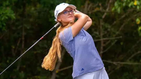Rugile Pauliukonyte stares down her drive floating high above the fairway