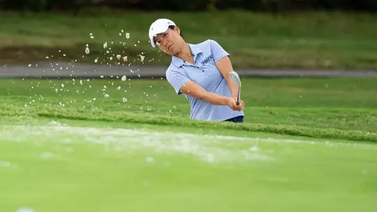 Elizabeth Jang blasts out of a bunker at Cherokee Country Club