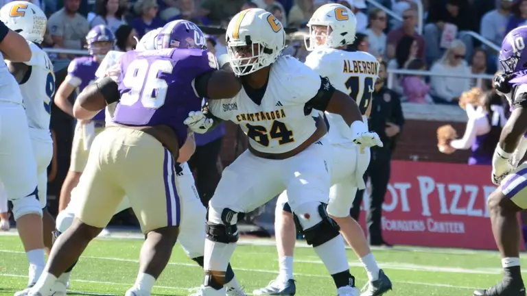 Tracy Jackson gets a shoulder into a Western Carolina rusher while maintaining is zone integrity in pass blocking.