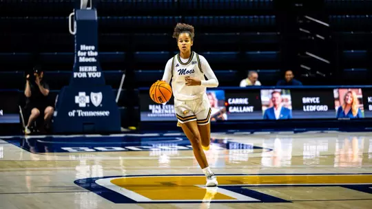 Sarah Owona dribbles the ball up the court