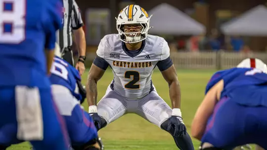 Kristian Ozane surveys the offense in a crouched stance pre-snap at West Georgia