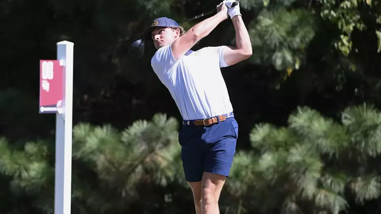 Ward Harris completes his swing arc following his drive down the fairway