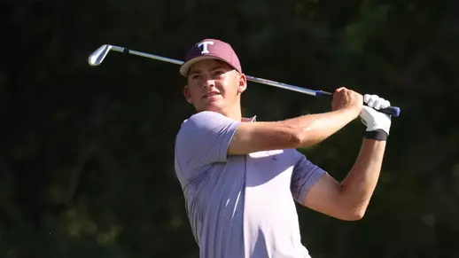 Aaron Pounds holds his follow through while tracking his iron shot.