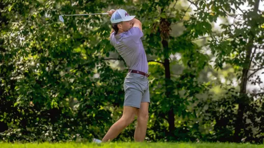 Wheaton Ennis blasting a ball at the Illini Invitational