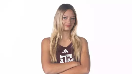 Sydney Jara poses with arms folded for her recruiting visit portrait shoot.