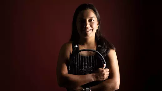 Lucciana Perez is all smiles as she embraces her racquet during a social content day photo shoot