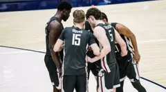 The Cougars huddle before a free throw at Pepperdine, Feb. 28, 2026