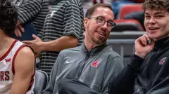 Pedro Garcia Rosado talks with Tomas Thrastarson on the bench