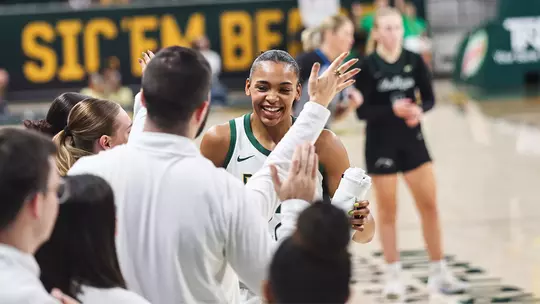 Bella Fontleroy celebrated on bench after scoring 1,000 career point