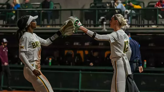 Cambree Creager and Brooklyn Carter High Five against MSU