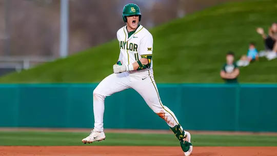 Tyce Armstrong rounding first base after hitting a grand slam 2026