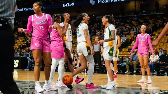 Kiersten Johnson, Darianna Littlepage-Buggs, Taliah Scott celebrate vs UCF