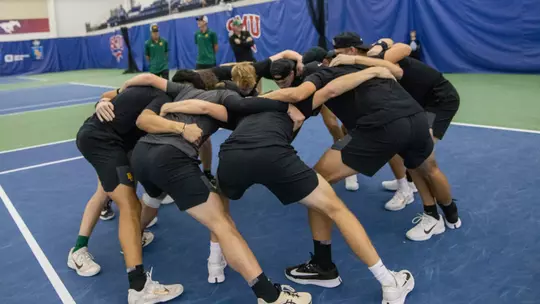 Team Huddle at ITA Indoor Semifinals vs Texas