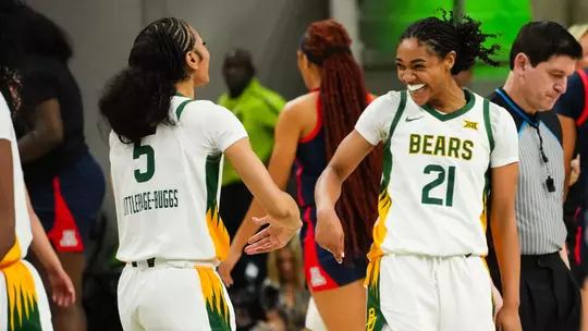 Darianna Littlepage-Buggs and Marcayla Johnson celebrate in win against Arizona