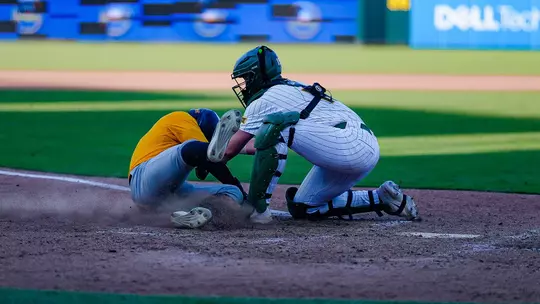Brayden Buchanan tagging a runner out at the plate against Southern Miss 2026