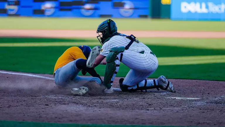 Brayden Buchanan tagging a runner out at the plate against Southern Miss 2026