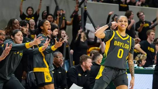 Taliah Scott and Bench celebrate 3-pointer vs K-State