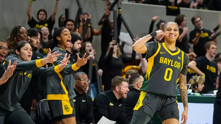 Taliah Scott and Bench celebrate 3-pointer vs K-State