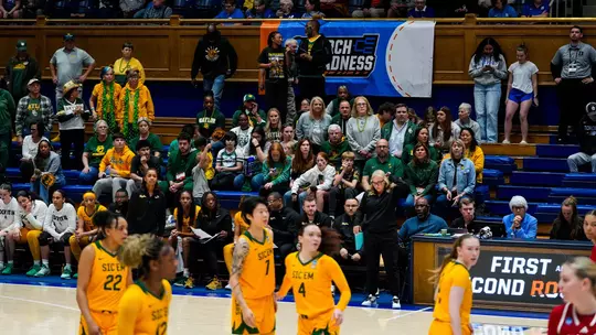 Baylor bench and fans watch NCAA First Round matchup vs Nebraska at Cameron Indoor Stadium