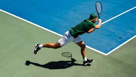 Zsombor Velcz returning serve in Big 12 Semifinals