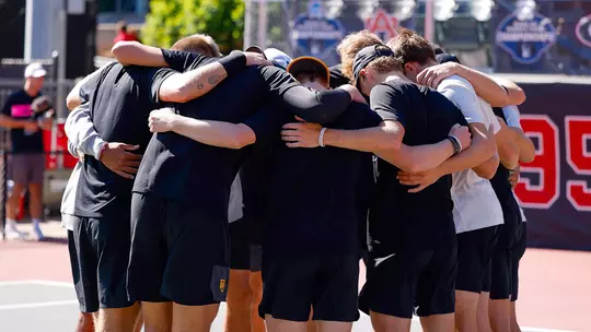 MT Team Huddle Before NCAA Elite Eight