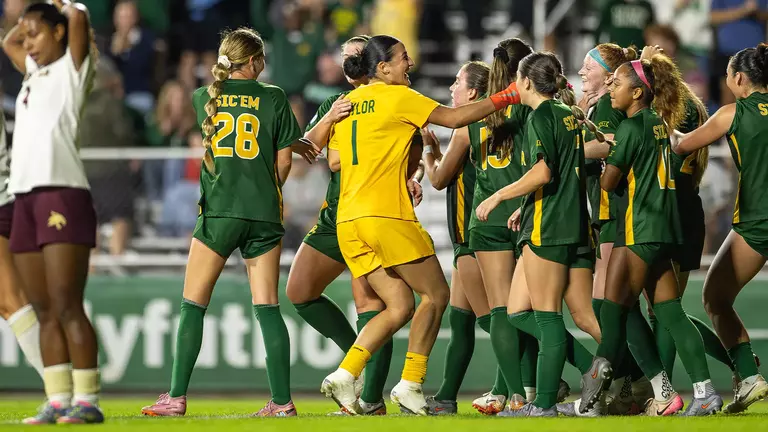 Azul Alvarez celebrates NCAA First Round win in team huddle