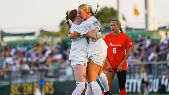 Grace White celebrates goal vs Pepperdine