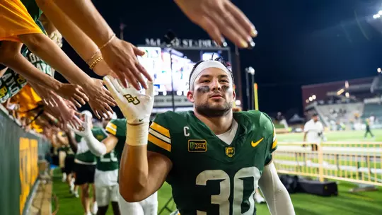 Michael Allen high-fiving fans after beating PVAMU 2026