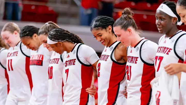 team celebrates an exhibition win
