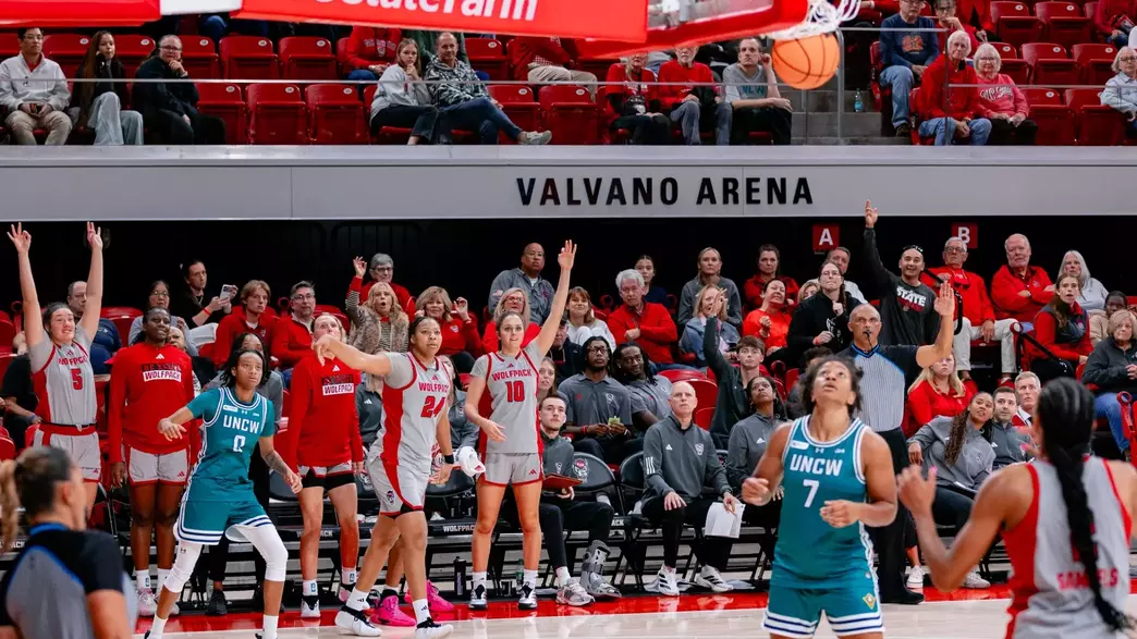 Bench cheers for Kamora Pruitt's 3-pointer