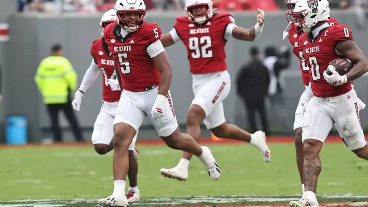 The Pack celebrates one of three Louisville turnovers.