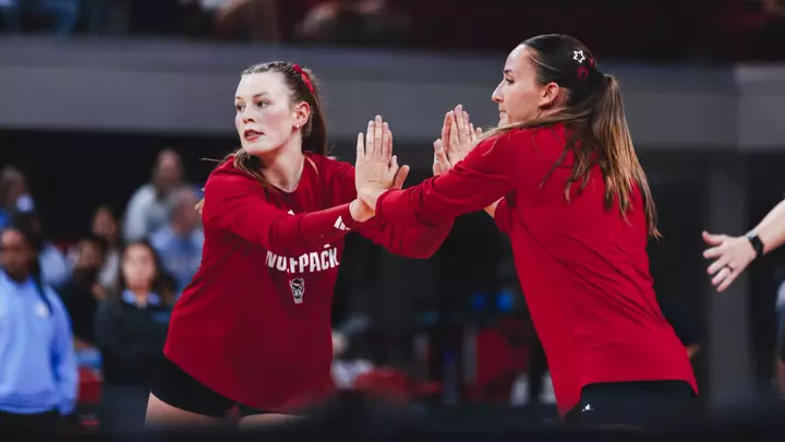 Rebecca Ring and Clara Vondran high-fiving during warm ups prior to UNC match 9/25/26