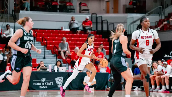 Qadence Samuels dribbles the ball up the court in NC State's exhibition game vs. High Point