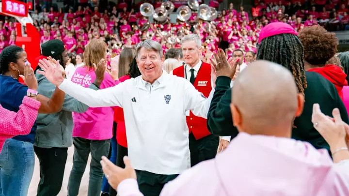 Wes Moore receives high fives from NC State women's basketball alumnae before the 2026 Play4Kay Game vs. North Carolina