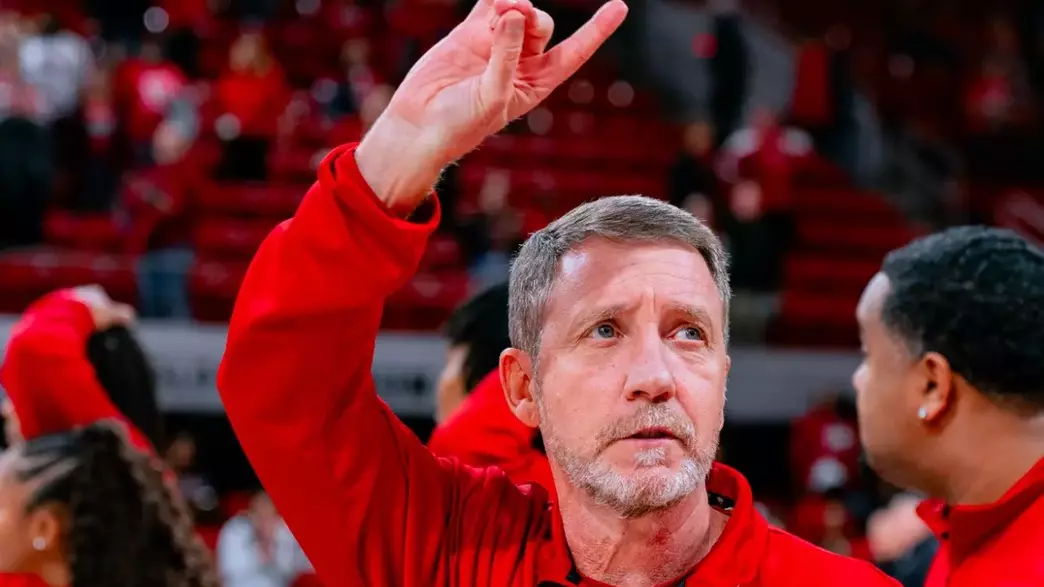 Assistant Coach Houston Fancher acknowledges the crowd after NC State defeated Clemson on Dec. 29, 2024
