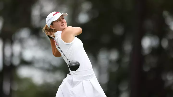 Marie Eline Madsen swings at the Cougar Classic