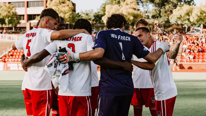 Group huddle vs. UNCW (Sept. 15, 2026)