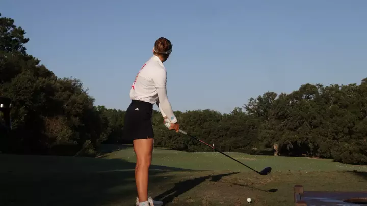 Marie Madsen tees off at the Cougar Classic