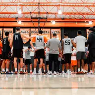 The Cowboys huddle up during a session in the practice gym.