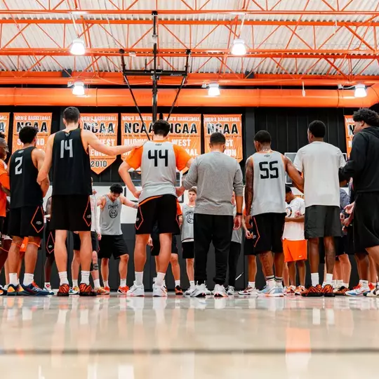 The Cowboys huddle up during a session in the practice gym.