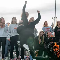 Members of the Oklahoma State softball team react to being selected to host a 2026 NCAA Regional.