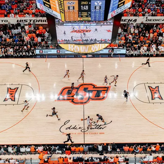 Wide shot of game action on Eddie Sutton Court