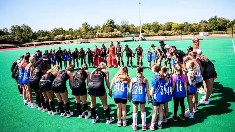 Field Hockey Huddles With Youths