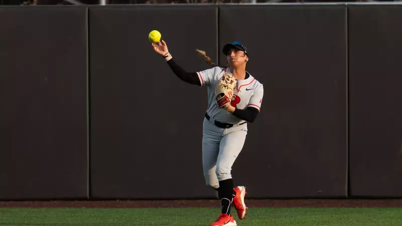 Rachel Millan in the outfield making a throw during the Wagner midweek game at the RU Softball Complex