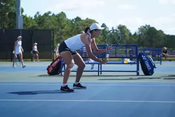 Nong playing doubles at ITA Southeast Regionals
