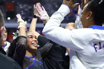 eMjae Frazier celebrates with teammates 260130