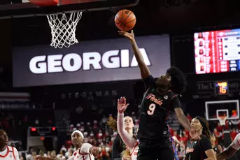Alexia Dizeko converts the driving baseline layup against Georgia