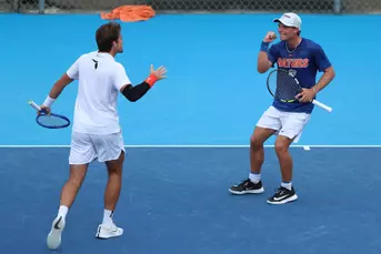 Kevin Edengren celebrating with Pablo Perez Ramos during singles.